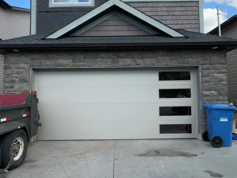 Newly installed contemporary garage door on a modern Calgary home